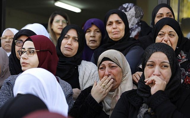 Mourners cry during the funeral of Israeli student Aya Maasarwe in the town of Baqa al-Gharbiya on January 23, 2019 (Ahmad GHARABLI / AFP)