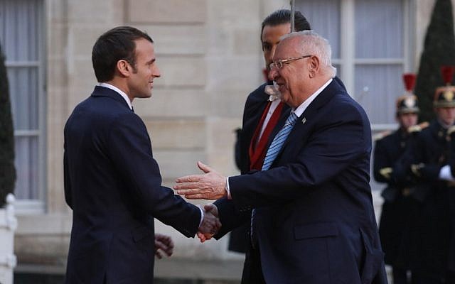 Israeli president Reuven Rivlin, right, is welcomed by French President Emmanuel Macron on his arrival at the Elysee Palace in Paris on January 23, 2019. (ludovic Marin/AFP)