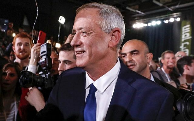Former IDF chief of staff Benny Gantz (C) is greeted by supporters as he arrives to give his first electoral speech in the coastal city of Tel Aviv on January 29, 2019. (Jack Guez/AFP)