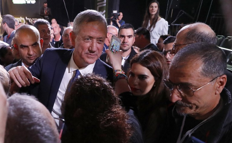 Former Israeli chief of staff Benny Gantz walks among supporters during an electoral rally after delivering his first campaign speech, in Tel Aviv on January 29, 2019. (Jack Guez/AFP)