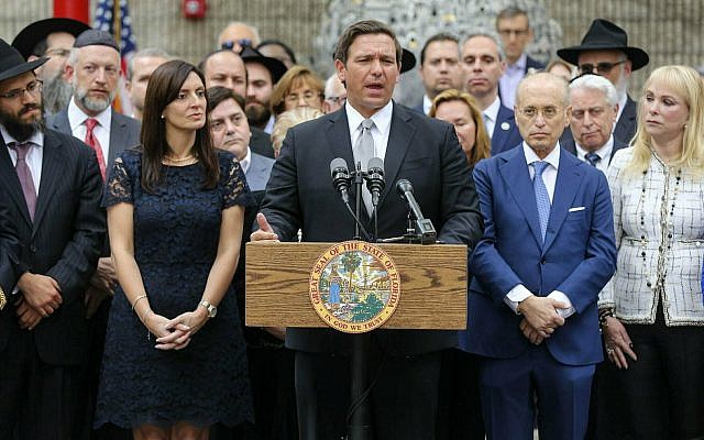 Florida Gov. Ron DeSantis speaks at a press conference at the Jewish Federation of South Palm Beach County in Boca Raton, Fla. Tuesday, Jan. 15, 2019. DeSantis says he is pushing for sanctions against Airbnb unless it reverses its decision barring lodging listings in the disputed West Bank in the Middle East.  (Bruce R. Bennett/Palm Beach Post via AP)