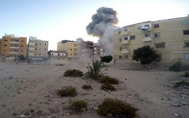 An explosion during an attack on an Egyptian police checkpoint  in el-Arish, north Sinai, Egypt, on January 9, 2017. (Islamic State Group in Sinai/AP)