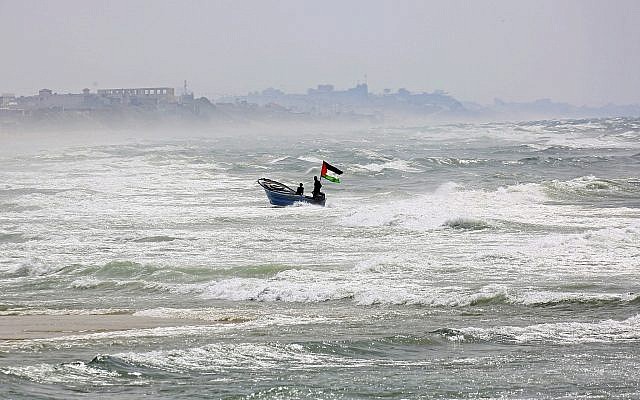 Illustrative: A fisherman navigates rough seas along the coast of the Mediterranean Sea in Gaza City, April 11, 2018. (Adel Hana/AP)