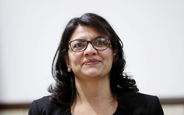 Rashida Tlaib, US Democratic Rep. for Michigan's 13th congressional district, listens during a rally in Dearborn, Michigan, October 26, 2018. (AP Photo/Paul Sancya)
