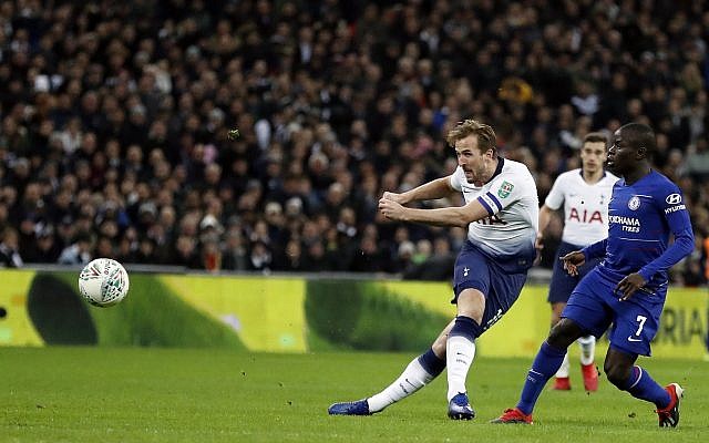 Tottenham's Harry Kane shoots the ball during the English League Cup semifinal first leg soccer match between Tottenham Hotspur and Chelsea at Wembley Stadium in London, Tuesday, Jan. 8, 2019. (AP Photo/Frank Augstein)