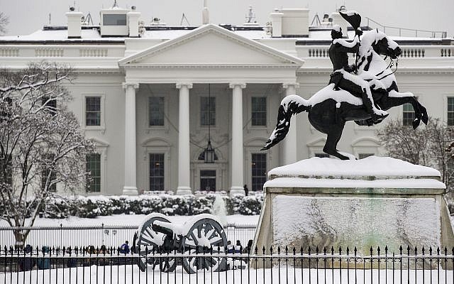 A snow covered White House White House on Sunday, Jan. 13, 2019, in Washington. (AP Photo/Alex Brandon)