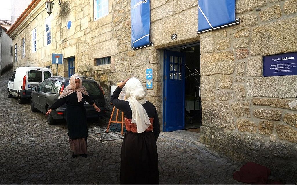 Actors re-enact scenes from the Inquisition period outside Belmonte's Jewish museum, October 14, 2018. (Cnaan Liphshiz)