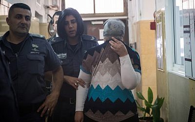 An ultra-Orthodox woman is brought to a Jerusalem court on July 29, 2018, under charges of abusing her children by injecting them with insulin (Yonatan Sindel/Flash90)