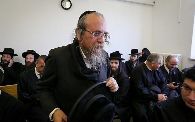 Matityahu Hirschman from “Kehillat Hamatmidim” arrives at Jerusalem District Court to hear the verdict in a case against him, on January 24, 2019. (Yonatan Sindel/Flash90)