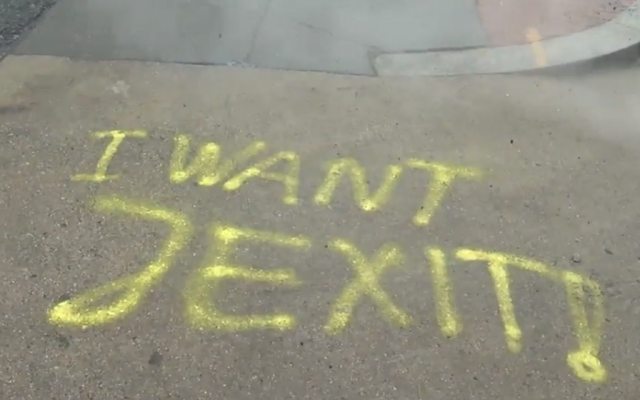 Graffiti reading "I Want Jexit" is seen outside Shalom Tire and Auto Repair in Washington, DC, on January 18, 2019. (Screen capture: WJLA-ABC 7)