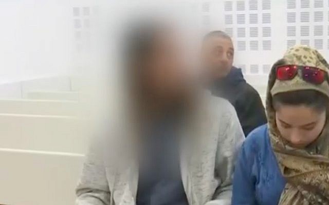 The Israeli teen (L) suspected of killing Aisha Rabi sits in the Rishon Lezion Magistrate's Court on January 23, 2019. (YouTube screenshot)