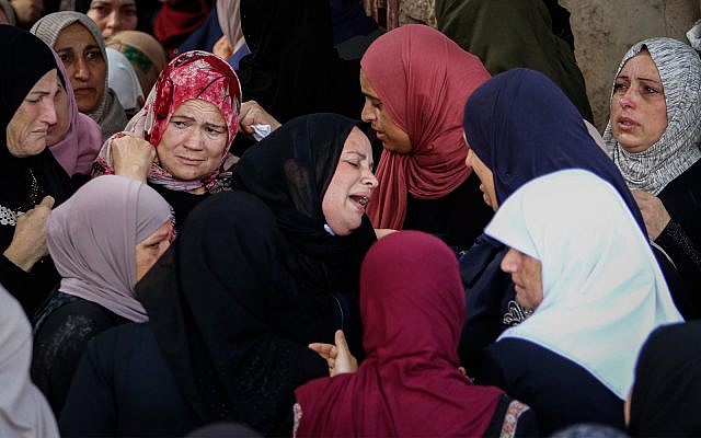 Palestinians mourn Aisha Rabi at her funeral  in the West Bank village of Bidya, near Salfit, on October 13, 2018. (Nasser Ishtayeh/Flash90)