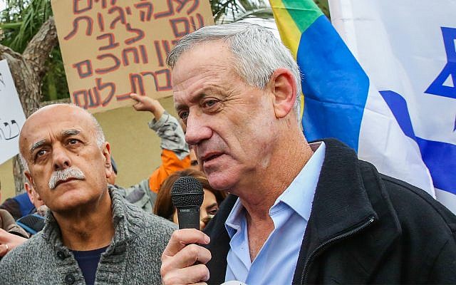 Former IDF chief of staff Benny Gantz seen with members of the Druze community and activists outside his home in Rosh Ha'ayin, during a protest against the nation-state law, January 14, 2019. (Flash90)
