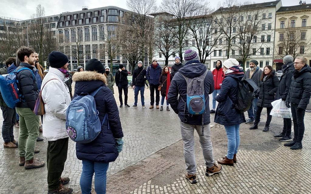 Volunteers gathering in Berlin's Kreuzberg neighborhood to clean stolpersteine on international Holocaust Remembrance Day, January 27, 2019. (Yaakov Schwartz/Times of Israel)