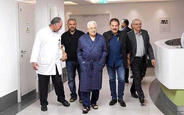 Palestinian Authority President Mahmoud Abbas, walking in a hospital, on May 21, 2018. (screen capture: Twitter)
