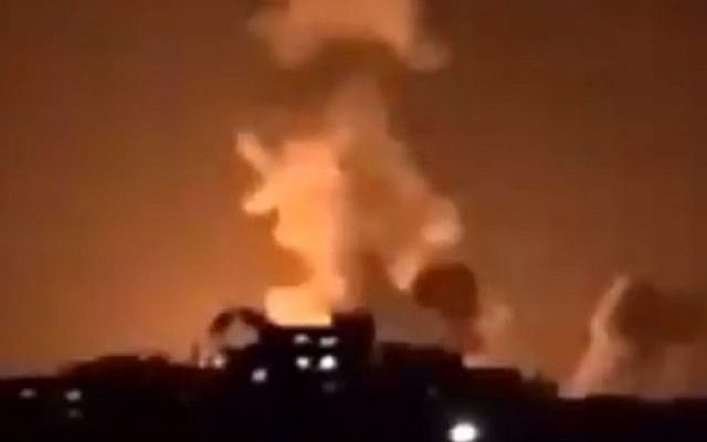 An explosion in the northern Gaza Strip from Israeli airstrikes lights up the night sky on January 22, 2019. (Screen capture: Facebook)
