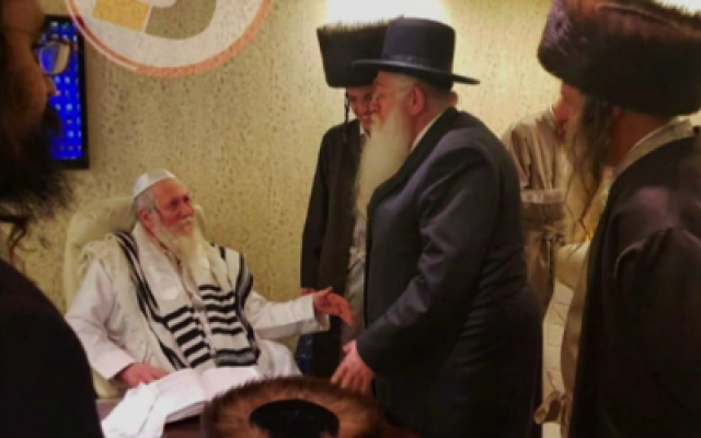 Rabbi Eliezer Berland (L), a convicted sex offender, meets with UTJ's Meir Porush at a Beit Shemesh wedding on January  6, 2019 (courtesy)