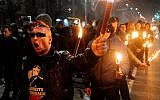Members of nationalist organizations parade with torches during a march to commemorate Bulgarian general and politician Hristo Lukov, in the center of Sofia, on February 16, 2019. (Dimitar DILKOFF/AFP)
