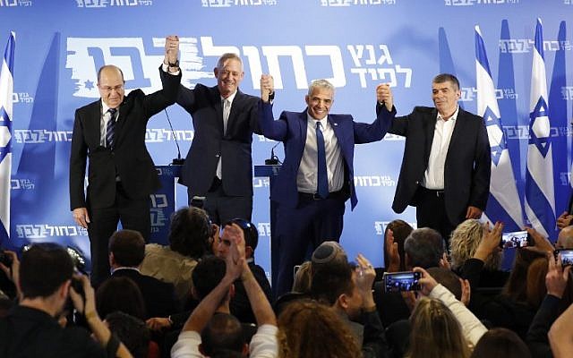 From left to right: Blue and White party leaders Moshe Ya'alon, Benny Gantz , Yair Lapid and Gabi Ashkenazi pose for a picture after announcing their new electoral alliance in Tel Aviv on February 21, 2019. (Jack Guez/AFP)
