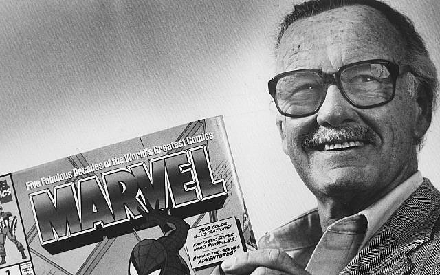 Stan Lee poses with a book of ‘Spider Man’ comics in 1991. Along with Spider Man, Lee created characters such as Iron Man, Thor and The Incredible Hulk. (Gerald Martineau/The Washington Post via Getty Images)