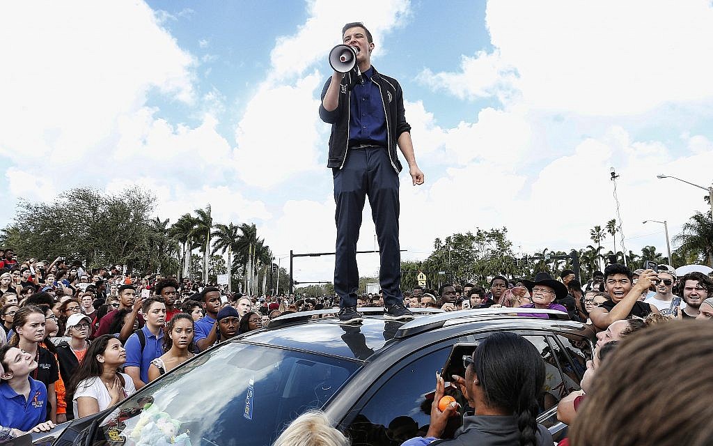 Marjory Stoneman High School student Cameron Kasky addresses area students at a rally at the school after participating in a countywide school walkout in Parkland, Florida, February 21, 2018. (Rhona Wise/AFP/Getty Images/via JTA)