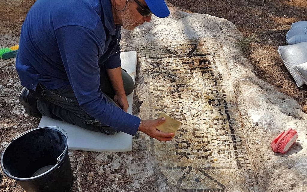 Preservation work on the 1,600-year-old inscription and wine press unearthed at the home of a wealthy Samaritan in Tzur Natan. (Galeb Abu Diab/Israel Antiquities Authority) 
