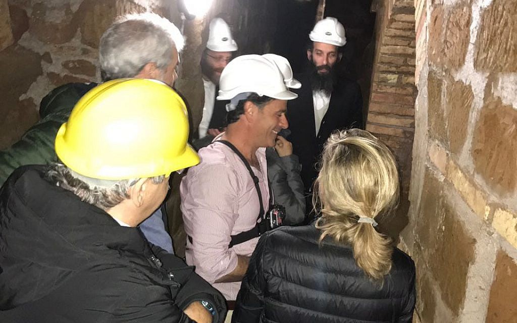 A group visiting the Villa Torlonia Jewish Catacombs guided by Amir Genach, center. (courtesy Amir Genach)