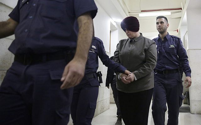 In this February 27, 2018, file photo, Malka Leifer, center, is brought to a courtroom in Jerusalem. (AP Photo/Mahmoud Illean, File)
