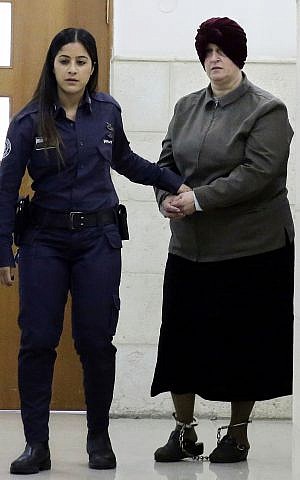 In this February 27, 2018, file photo, Australian Malka Leifer, right, is brought to a courtroom in Jerusalem. (AP Photo/Mahmoud Illean, File)