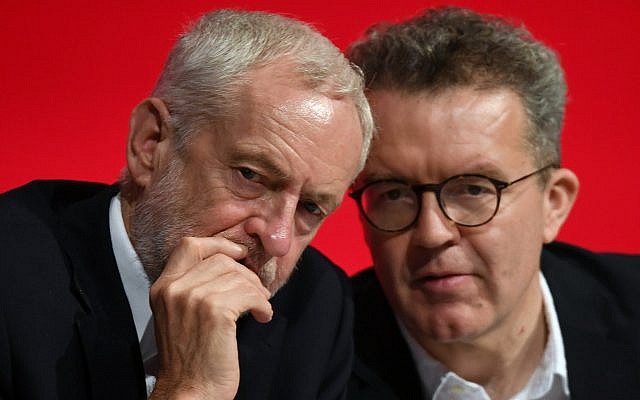 Britain's opposition Labour Party leader Jeremy Corbyn, left, talks with deputy leader Tom Watson, during the start of the party's annual conference in Liverpool, England, September 23, 2018. (Stefan Rousseau/PA via AP)