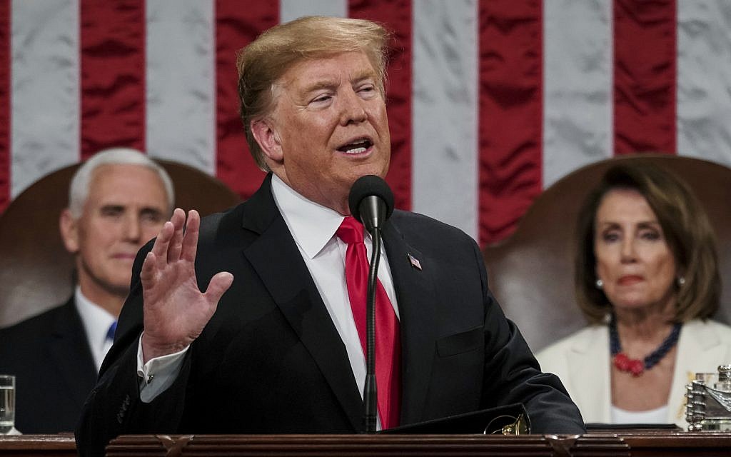 US President Donald Trump gives his State of the Union address to a joint session of Congress, February 5, 2019, at the Capitol in Washington, as Vice President Mike Pence, left, and House Speaker Nancy Pelosi look on. (Doug Mills/The New York Times via AP, Pool)