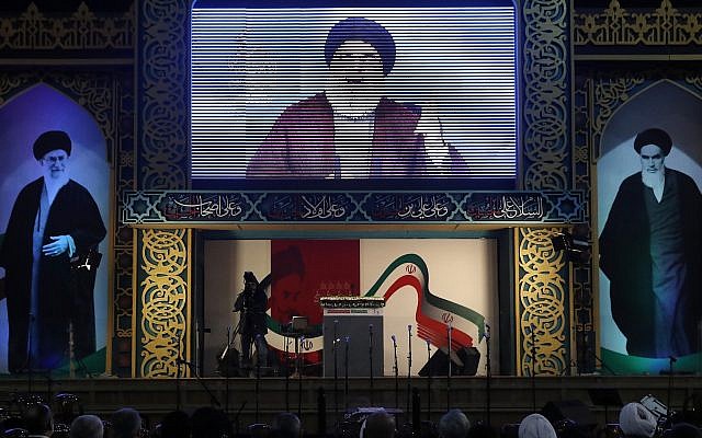 Hezbollah leader Hassan Nasrallah delivers a live broadcast speech, during a rally to commemorate the 40th anniversary of Iran's Islamic Revolution, in southern Beirut, Lebanon, Wednesday, Feb. 6, 2019. (AP Photo/Hussein Malla)