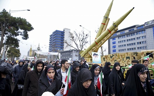 Iranians walk past a missile during a rally marking the 40th anniversary of the 1979 Islamic Revolution, in Tehran, Iran, February 11, 2019. (AP/Ebrahim Noroozi)