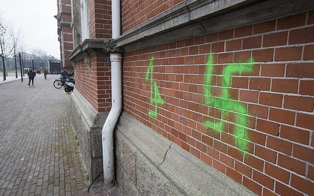 A swastika, painted on the wall of the Stedelijk Museum overnight, is seen in Amsterdam, Netherlands, February 22, 2019 (AP Photo/Peter Dejong)