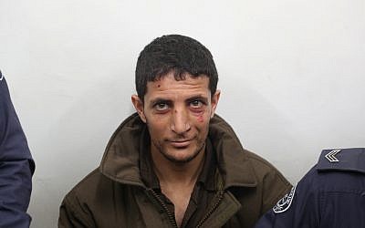 Arafat Irfaiya, charged with the murder of 19-year-old Ori Ansbacher, at the Jerusalem Magistrate's court on February 11, 2019. (Yonatan Sindel/Flash90)