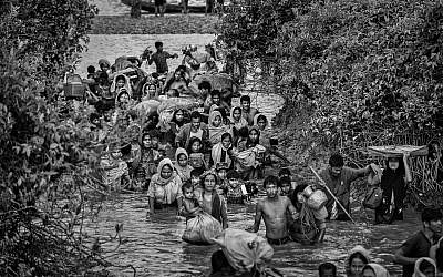 Rohingya Muslim refugees crowd a canal as they flee over the border from Myanmar into Bangladesh, November 1, 2017. (Kevin Frayer/Getty Images/via JTA)