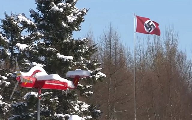 Screen capture of a swastika flag displayed on a pole in Charlottetown, Prince Edward Island, Canada, February 2019. (YouTube)