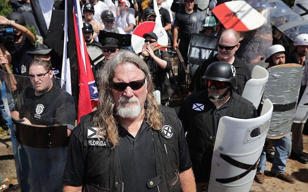 White supremacists exchange insults with counter-protesters as they attempt to guard the entrance to Emancipation Park in Charlottesville, Virginia, August 12, 2017. (Chip Somodevilla/Getty Images via JTA)