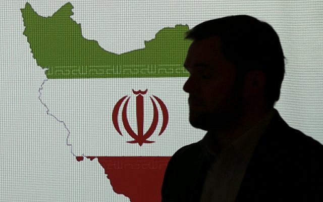 Illustrative: A cybersecurity expert stands in front of a map of Iran as he speaks to journalists about the techniques of Iranian hacking, September 20, 2017, in Dubai, United Arab Emirates. (AP Photo/Kamran Jebreili)