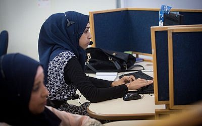 Israeli Bedouin women working at a Bezeq customer service center, located in a mosque, in the southern Arab town of Hura, July 27, 2015. (Miriam Alster/FLASH90)