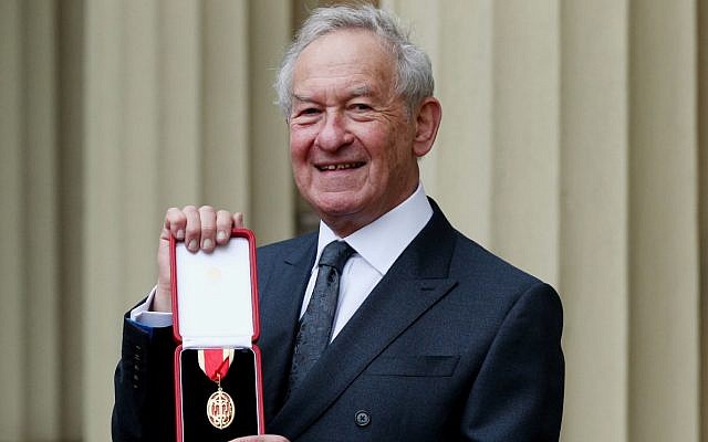 Historian Simon Schama poses after being awarded a knighthood in an investiture ceremony at Buckingham Palace in London, February 5, 2019. (Jonathan Brady/WPA Pool/Getty Images via JTA)