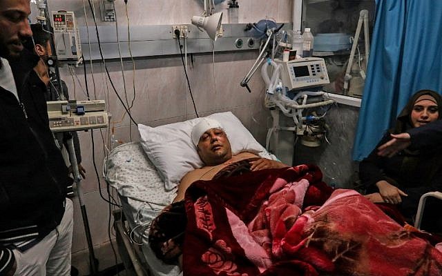 Atef Abu Seif, spokesman for Fatah in Gaza and a member of its central committee, lies in a hospital bed in Gaza City on March 19, 2019. (Mahmud Hams/AFP)