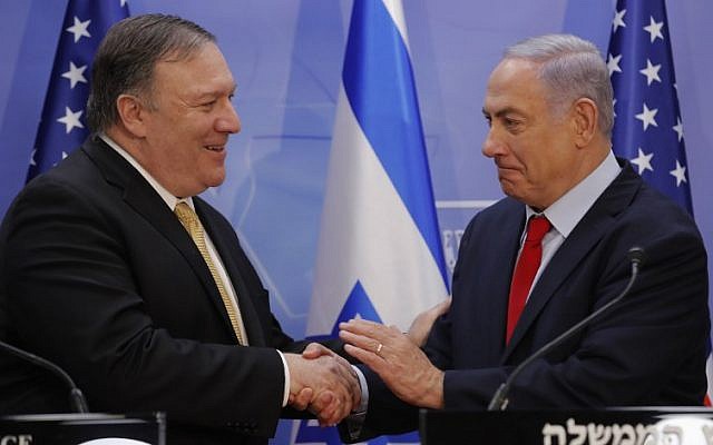 US Secretary of State Mike Pompeo, left, and Prime Minister Benjamin Netanyahu shake hands after delivering a joint statement during their meeting in Jerusalem on March 20, 2019. (Jim Young/Pool/AFP)