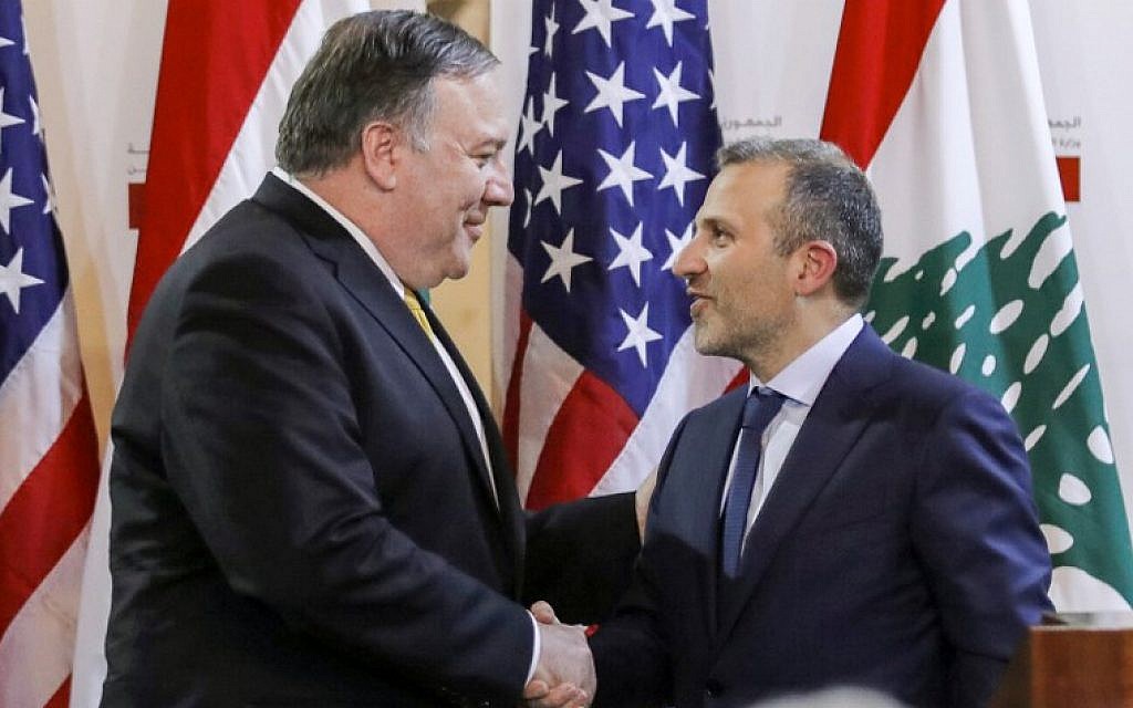 Lebanese Foreign Minister Gibran Bassil (R) shakes hands with visiting US Secretary of State Mike Pompeo following a public statement in the Lebanese capital Beirut on March 22, 2019. (Jim Young/Pool/AFP)