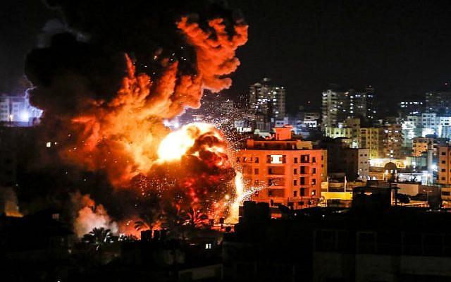A ball of fire bellows above buildings in Gaza City during Israeli strikes on March 25, 2019. (Mahmud Hams/AFP)