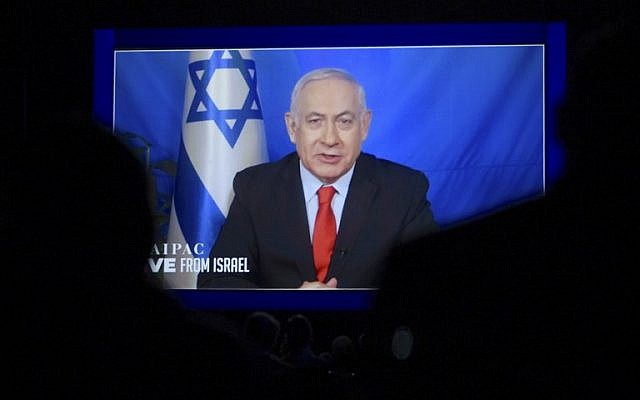 Prime Minister Benjamin Netanyahu speaks from Israel via video link at the annual AIPAC conference in Washington on March 26, 2019. ( Jim Watson/AFP)