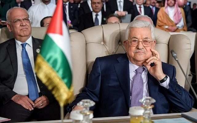 Palestinian Authority President Mahmoud Abbas (R) and Palestine Liberation Organization (PLO) Executive Committee Secretary-General Saeb Erekat (L) attend the opening session of the 30th Arab League summit in the Tunisian capital Tunis on March 31, 2019. (Fethi Belaid/Pool/AFP)