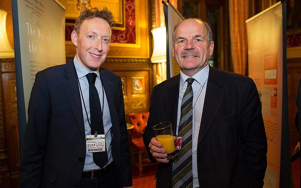 The Association of Jewish Refugees' Michael Newman, right, and British politician John Attlee in London November 21, 2018. (Courtesy of AJR)