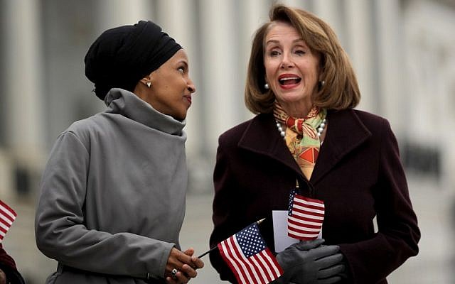 Representative Ilhan Omar of Minnesota talks with House Speaker Nancy Pelosi during a rally with fellow Democrats before voting on H.R. 1, or the People Act, on the East Steps of the US Capitol, March 8, 2019, in Washington. (Chip Somodevilla/Getty Images/AFP)