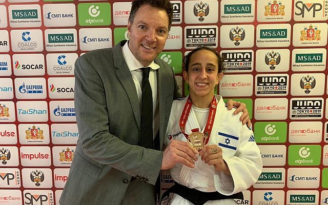 Israeli judoka Gili Cohen (R) poses for a photo with coach Shani Hershko after winning the gold medal at the Grand Slam competition in Ekaterinburg, Russia on March 15, 2019. (Israel Judo Association)